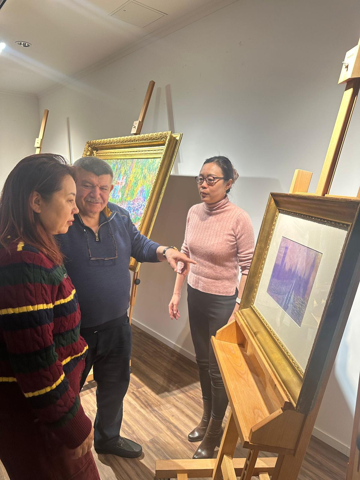 Andranik Ghazarian discussing two works with (Gallery: In the viewing room)